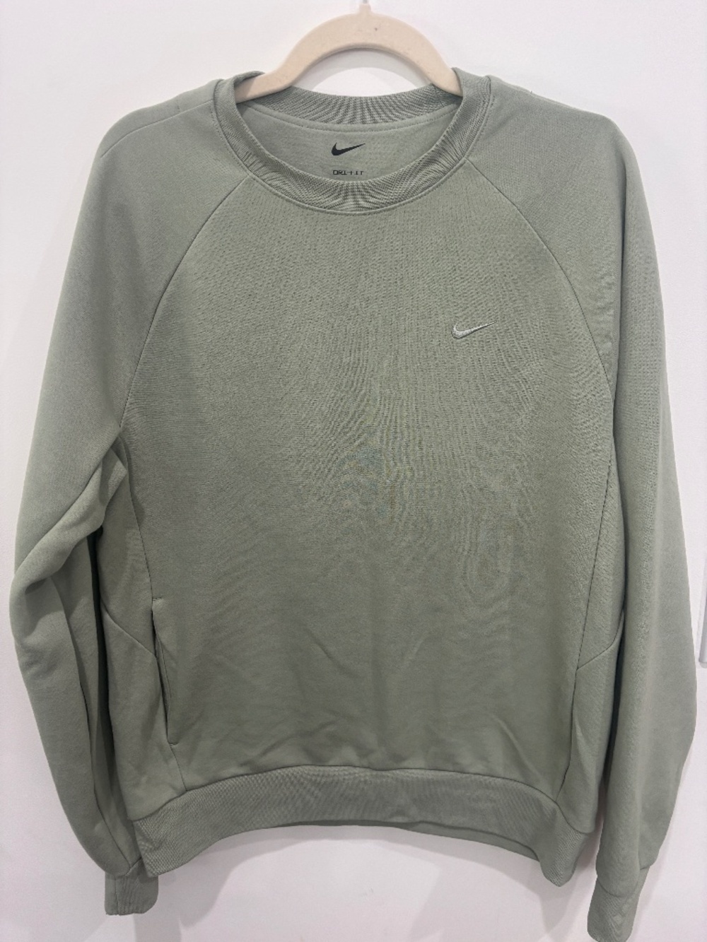Nike Men's Primary Dri-FIT UV Versatile sweatshirt features a sage green color a